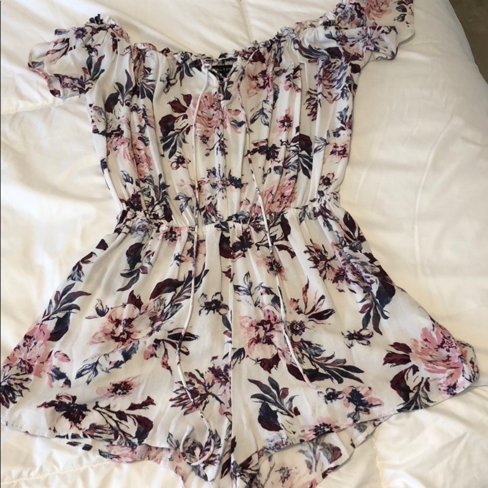 White pink and navy floral romper.